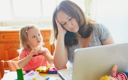 mother working from home looking after child