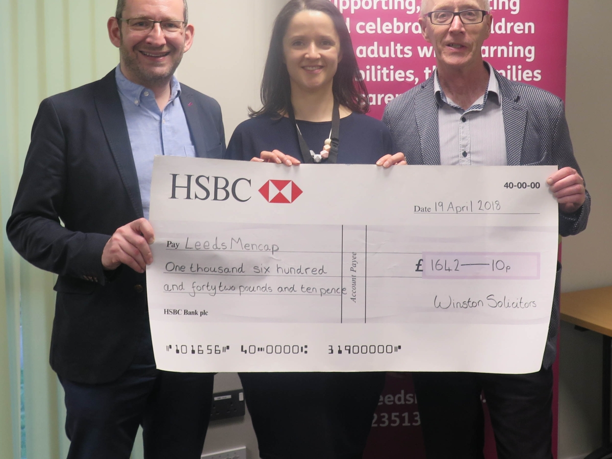 Winston Solicitors presenting charity cheque to Leeds Mencap