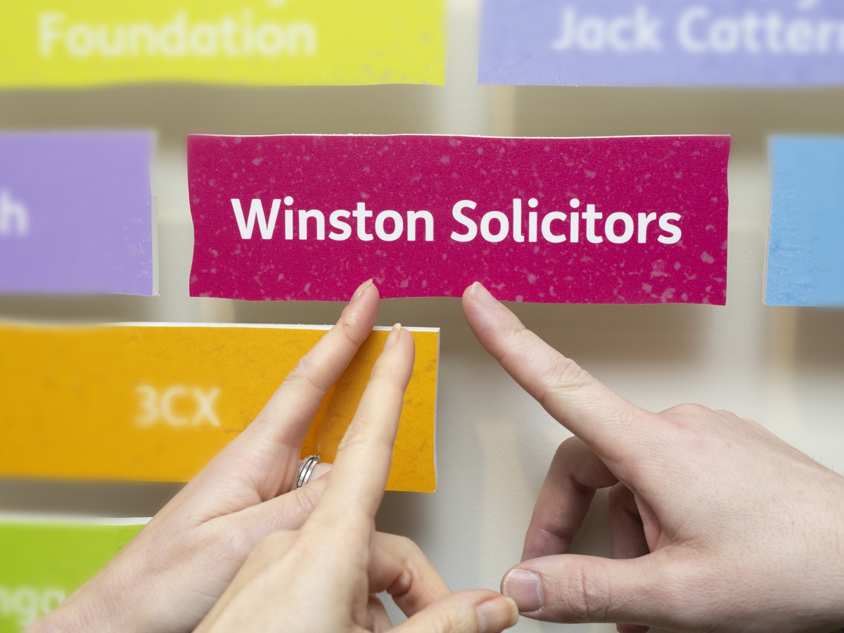 Leeds Mencap presented Winston Solicitors with their supporters brick