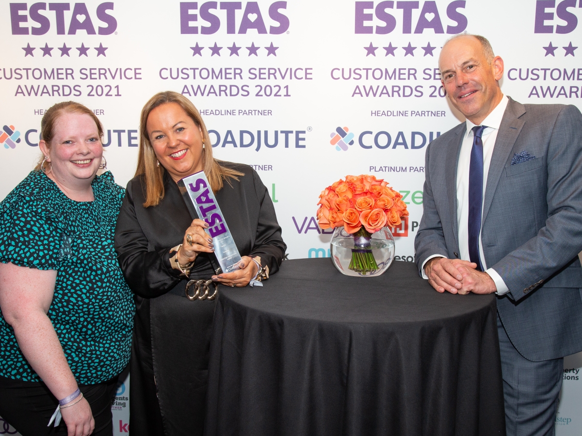 Leasa Foster and Samantha Robertson-Strong of Winston Solicitors collect their ESTAS award from Phil Spencer